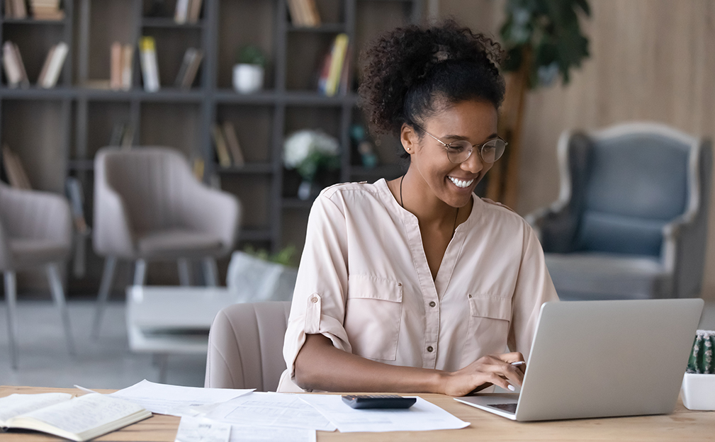 Female student on laptop at desk