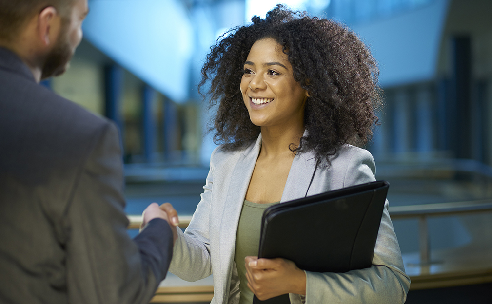 Female shaking hands during a job interview